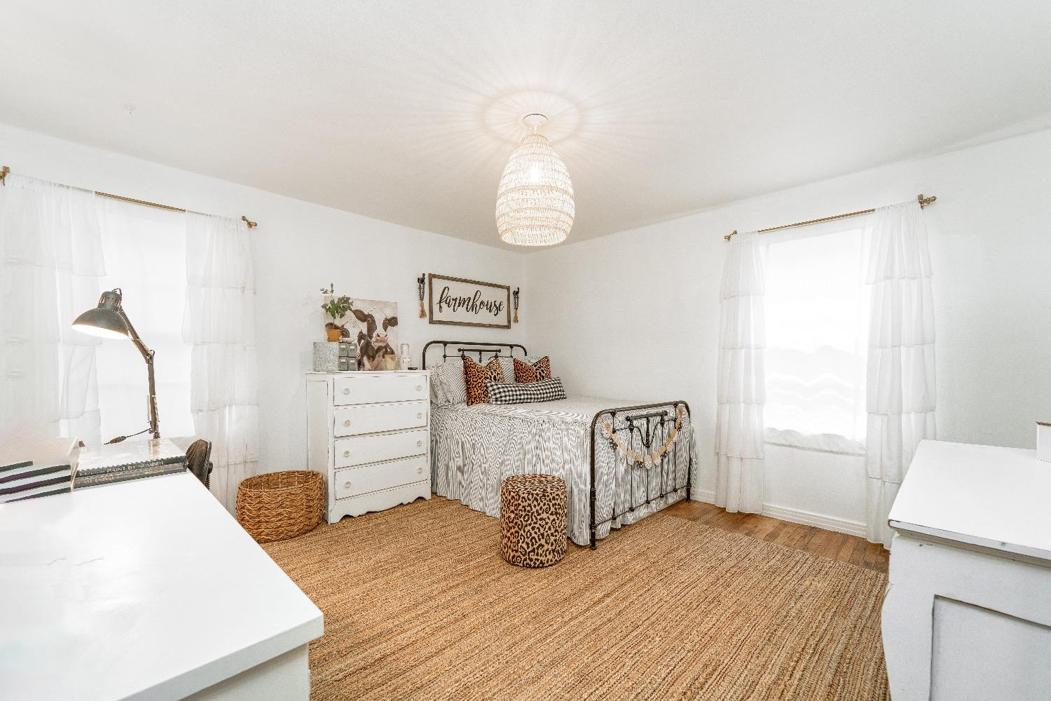 2504 42nd Street Lubbock, TX 79413 - Photo 14 of 24 a bedroom with a bed and table chair