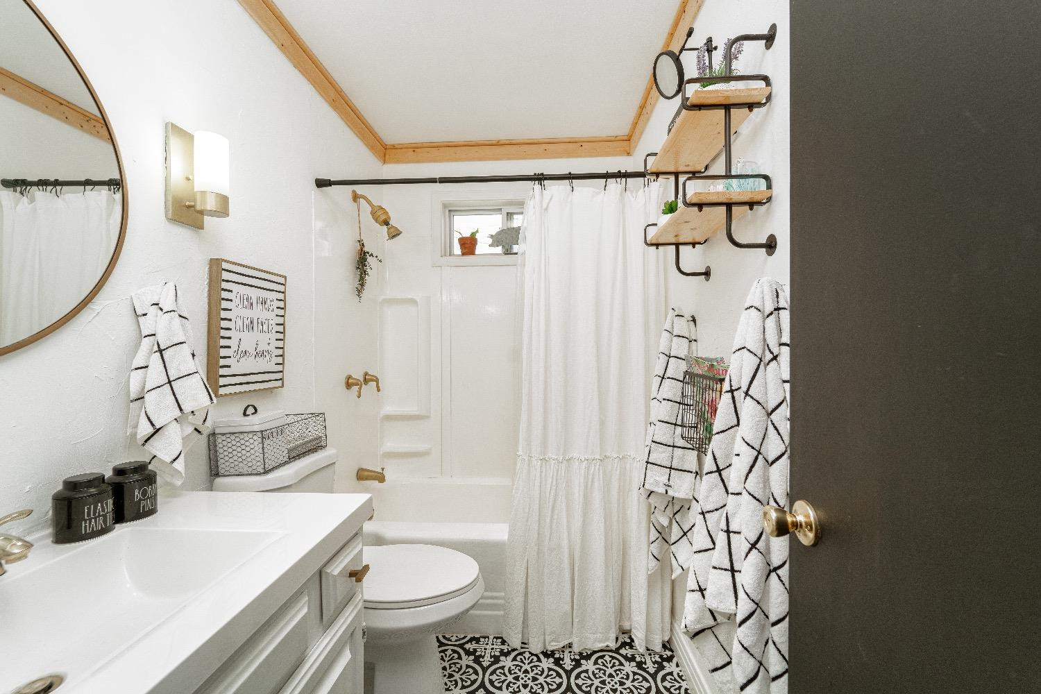 2504 42nd Street Lubbock, TX 79413 - Photo 16 of 24 a bathroom with a sink toilet and shower