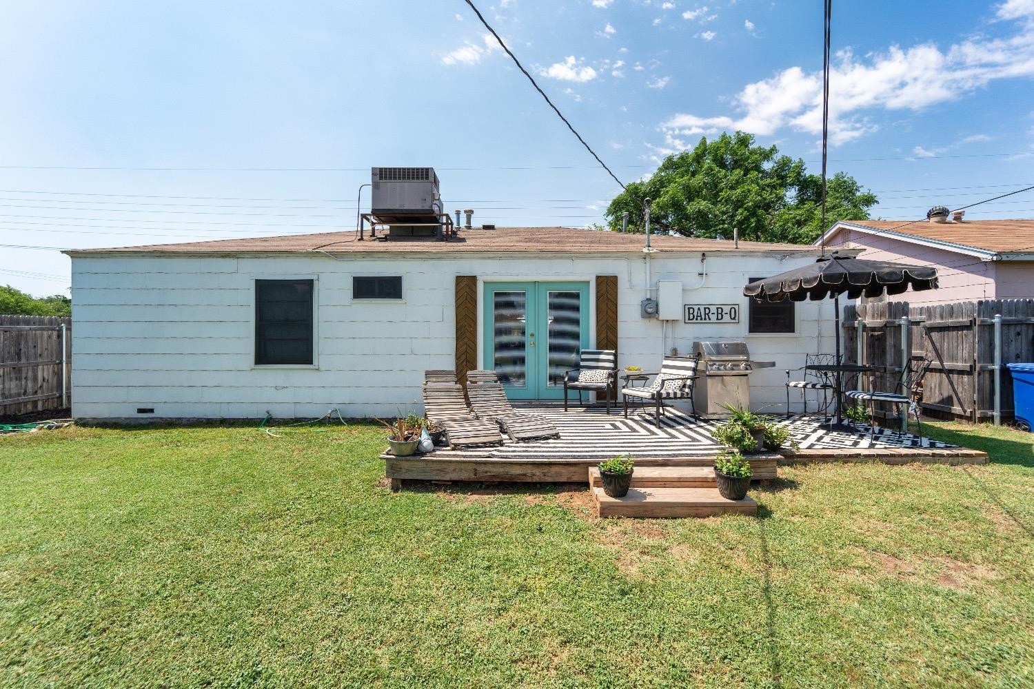 2504 42nd Street Lubbock, TX 79413 - Photo 22 of 24 a view of a house with backyard and sitting area