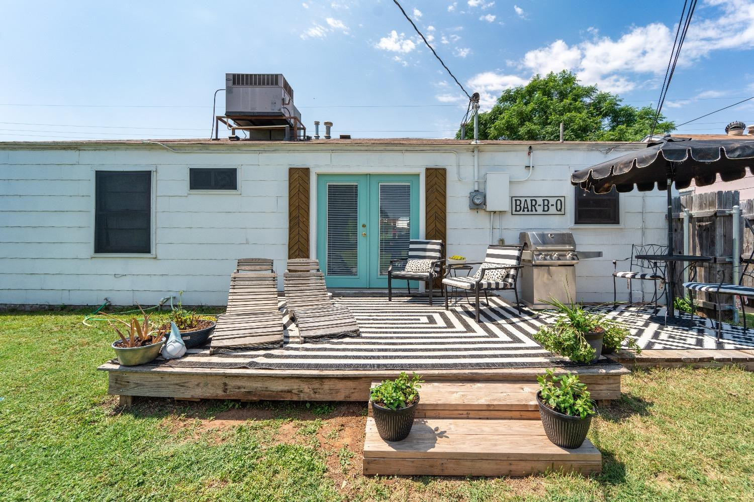 2504 42nd Street Lubbock, TX 79413 - Photo 23 of 24 a view of a house with pool backyard and chairs