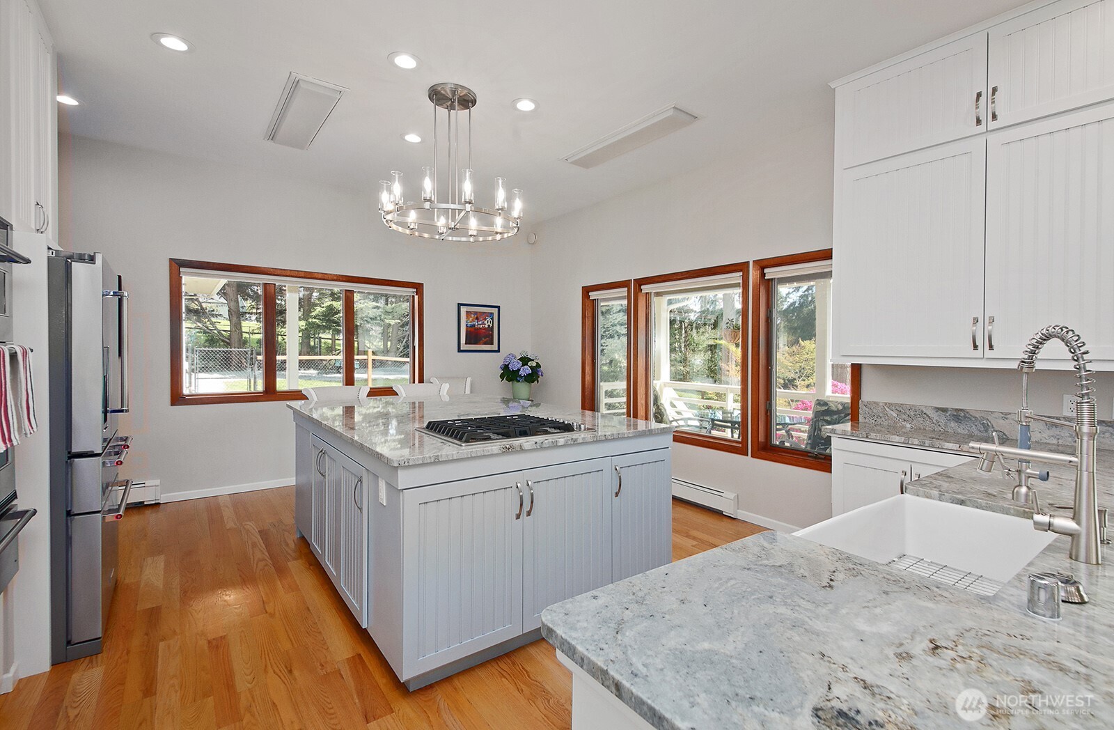5741 Crow Haven Road Langley, WA 98260 - Photo 22 of 40 a kitchen with stainless steel appliances granite countertop a sink stove and refrigerator