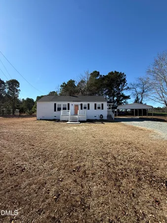 a front view of house with a yard