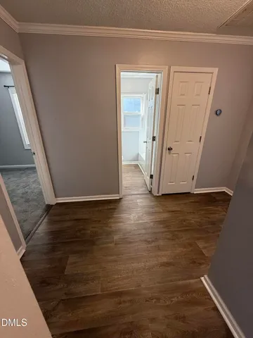 a view of a livingroom with wooden floor