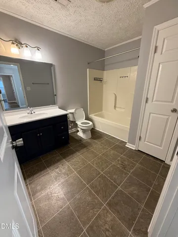 a bathroom with a sink vanity and tub