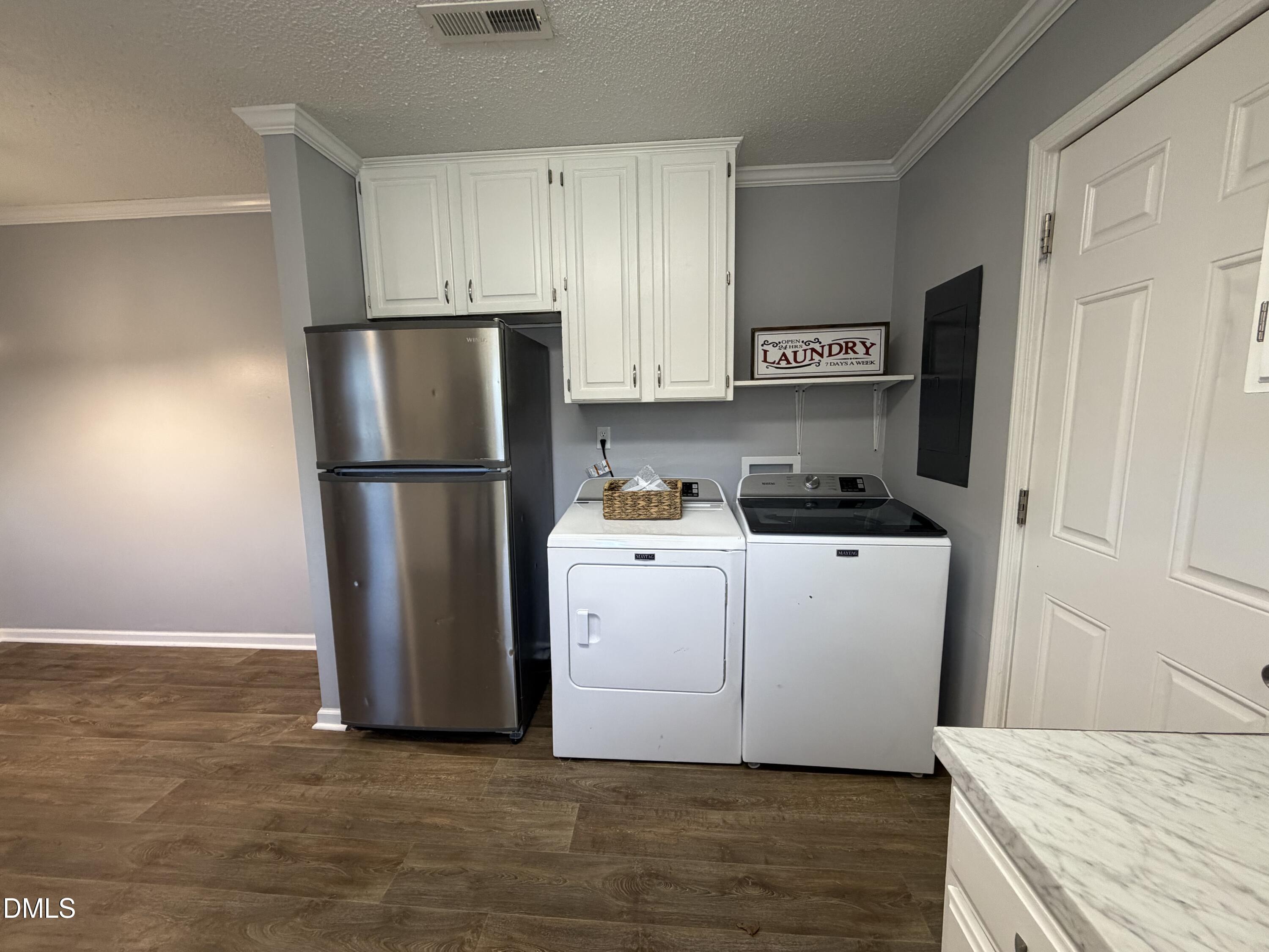 3792 McNeill Hobbs Road Bunnlevel, NC 28323 - Photo 12 of 12 a kitchen with a refrigerator and a stove top oven
