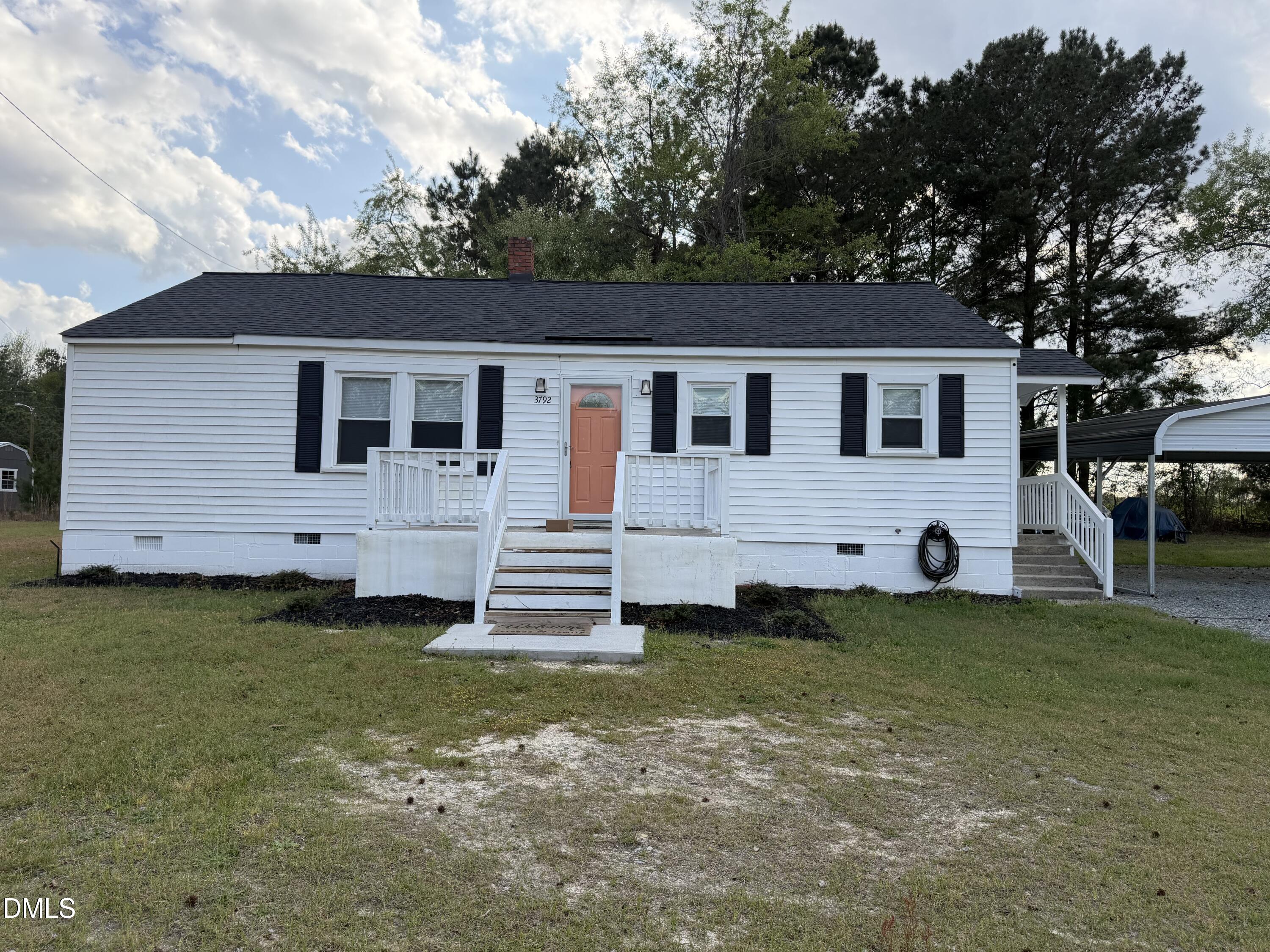 3792 McNeill Hobbs Road Bunnlevel, NC 28323 - Photo 2 of 12 a view of a house with a yard