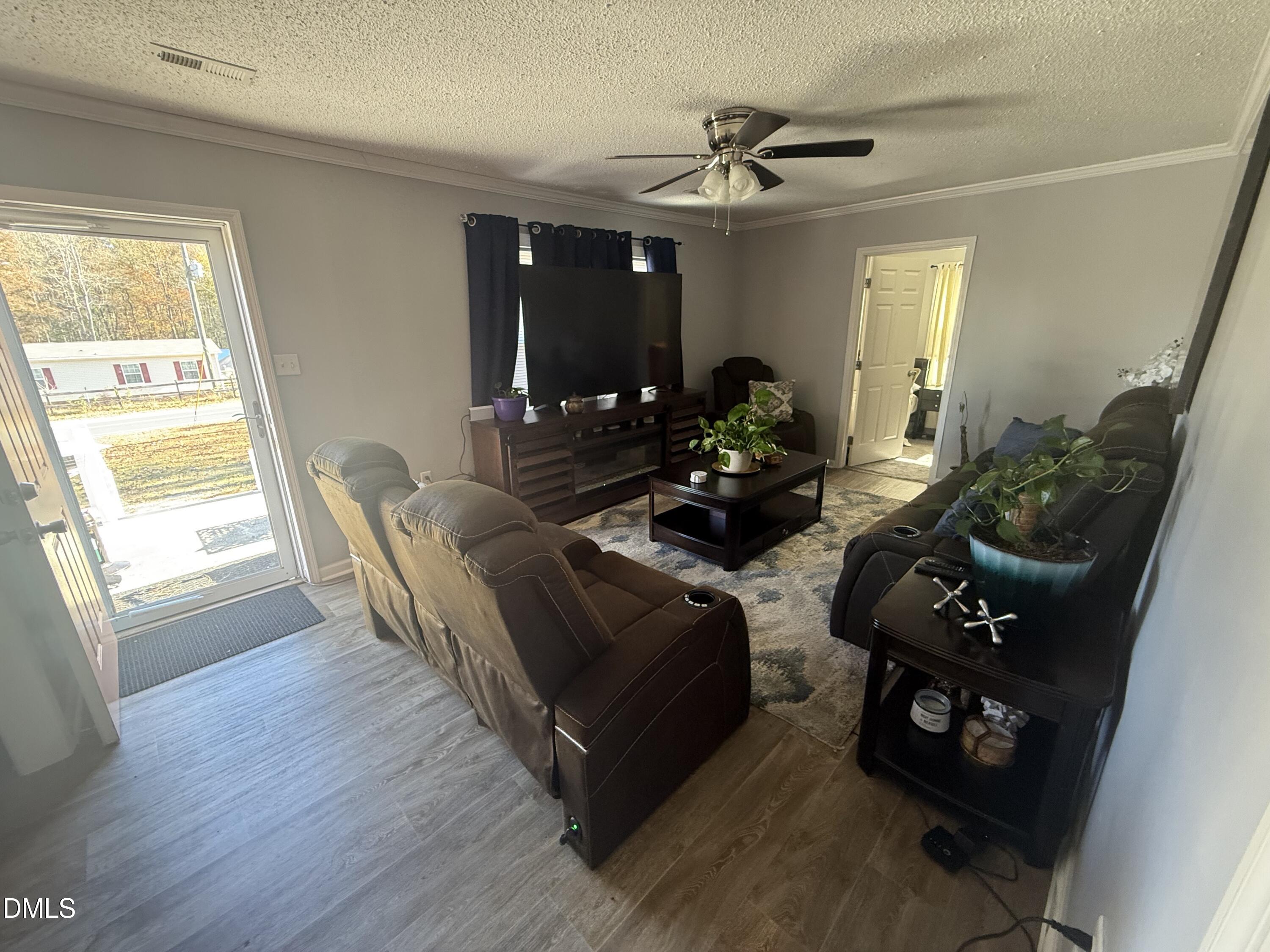 3792 McNeill Hobbs Road Bunnlevel, NC 28323 - Photo 9 of 14 a living room with furniture and a large window