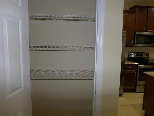 a close view of a closet with wooden floor