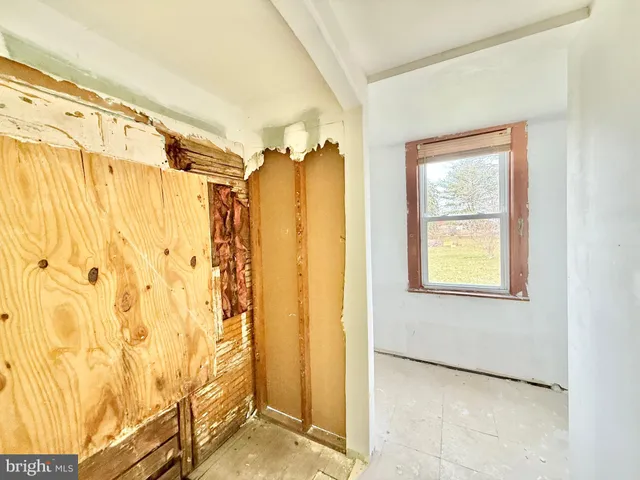 a view of a bathroom with a shower and a window