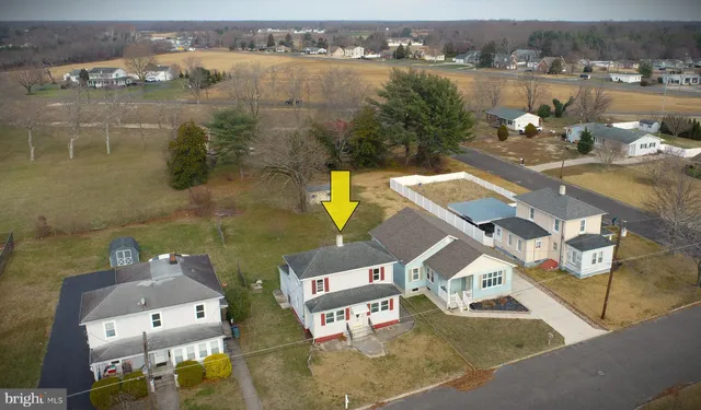an aerial view of a house with lake view