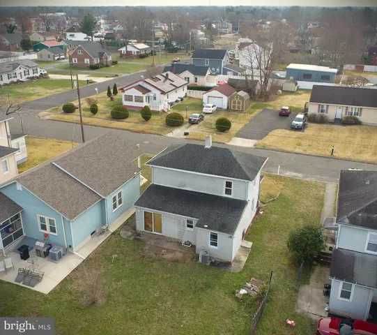an aerial view of a house with a ocean view