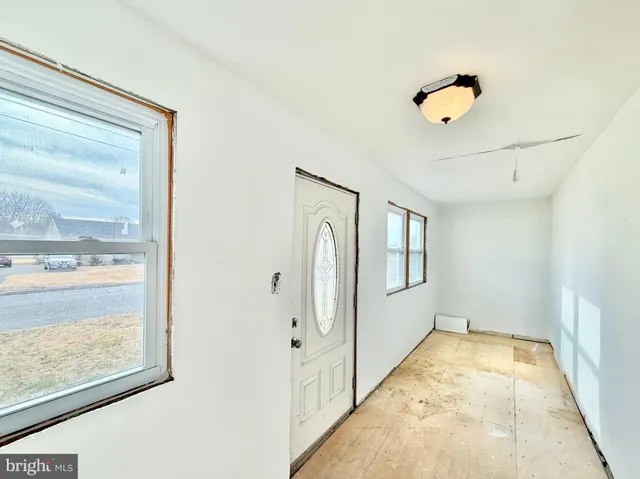 a view of a hallway with windows