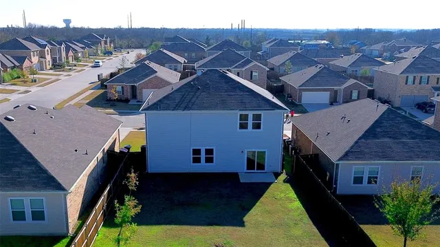 a aerial view of a house with a yard