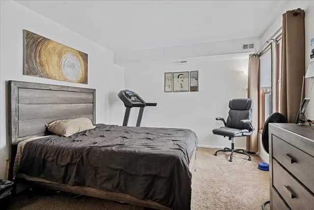 a bedroom with a bed and furniture