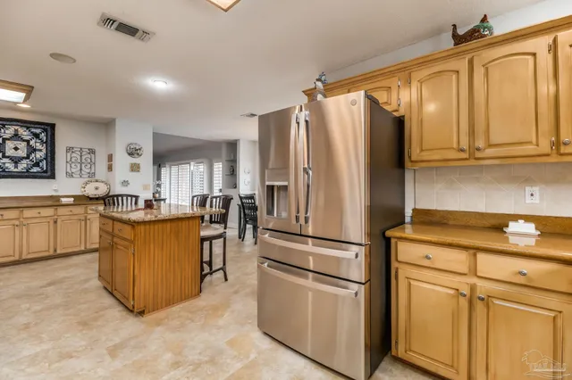a dining room with furniture a window and wooden floor