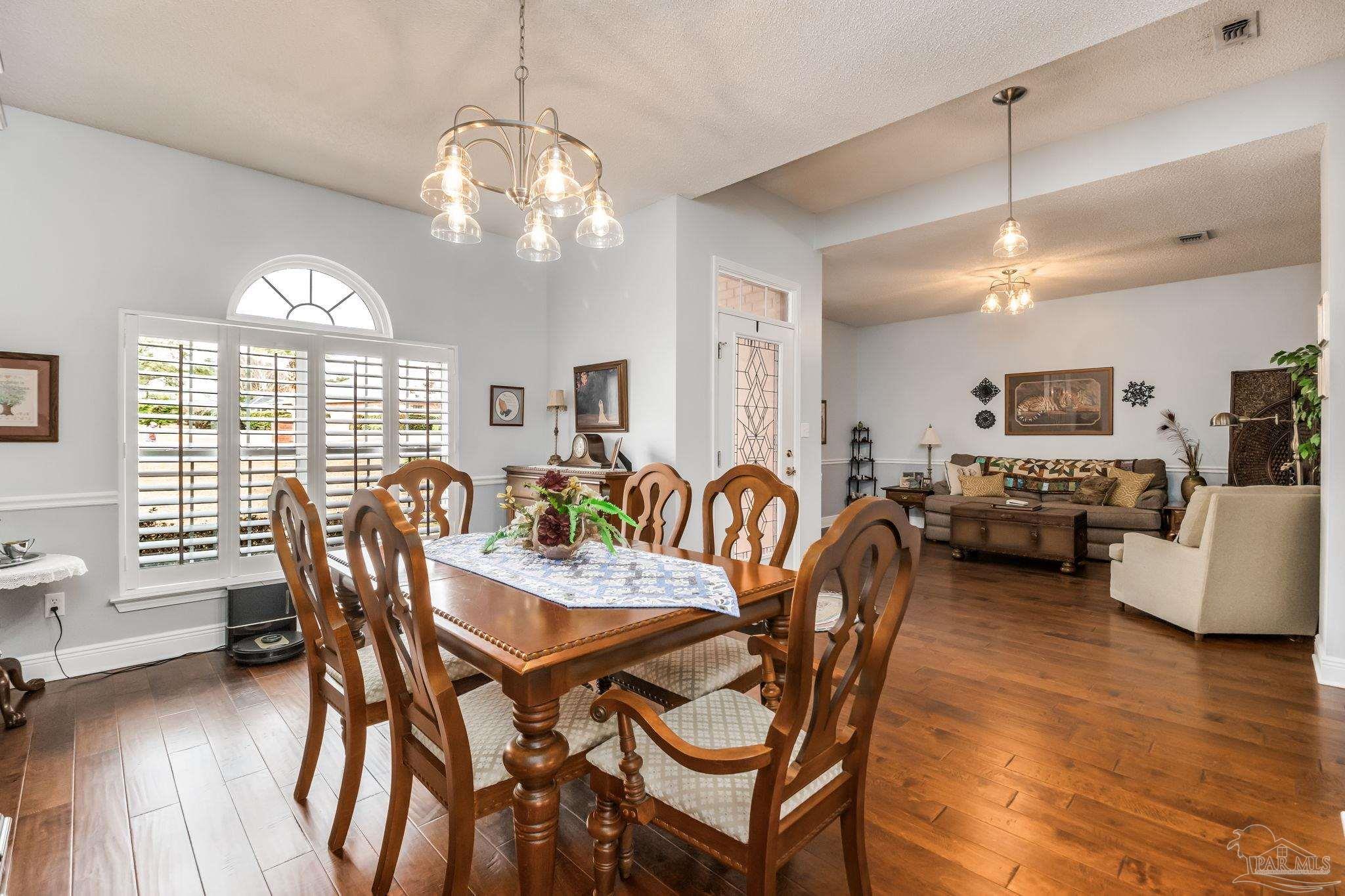 3106 Cobblestone Drive Pace, FL 32571 - Photo 2 of 61 a view of a dining room with furniture window and wooden floor