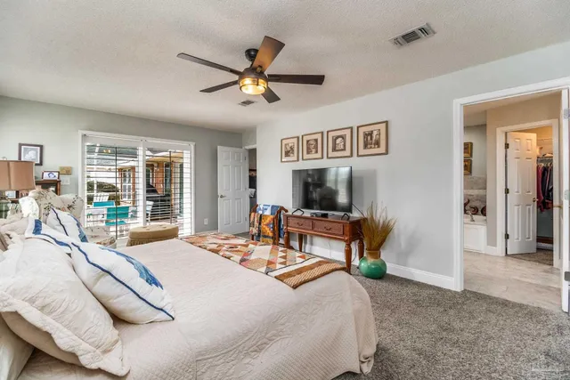 a bedroom with two beds and a window