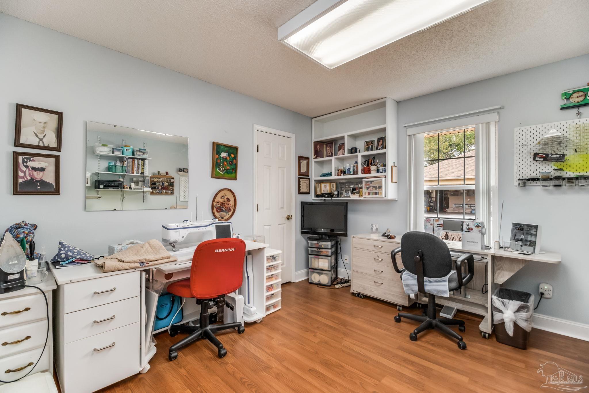 3106 Cobblestone Drive Pace, FL 32571 - Photo 39 of 61 a view of a workspace with furniture and a window