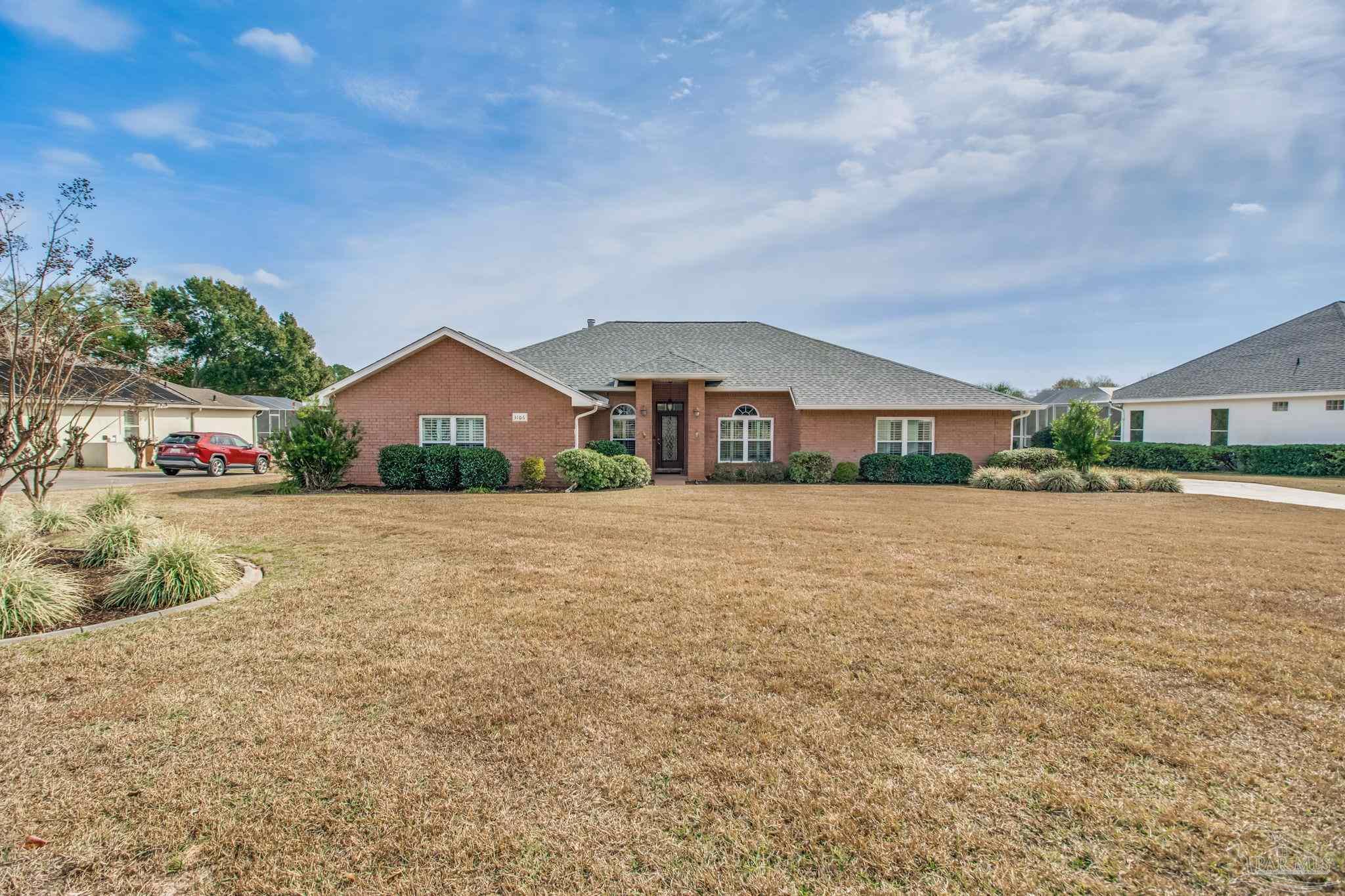 3106 Cobblestone Drive Pace, FL 32571 - Photo 49 of 61 a front view of a house with a yard