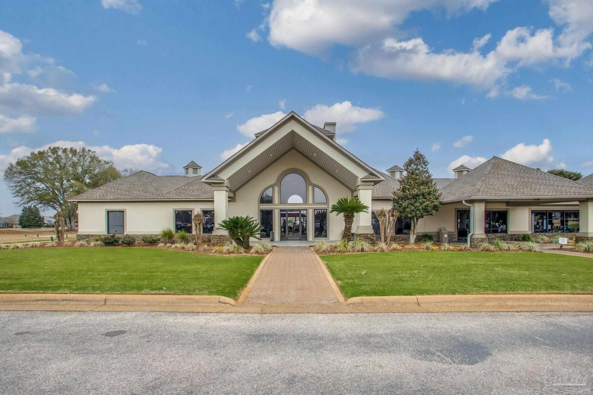 3106 Cobblestone Drive Pace, FL 32571 - Photo 60 of 61 a front view of house with yard and green space