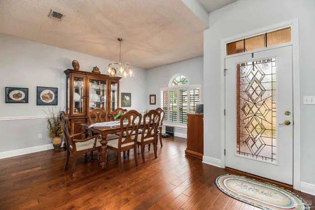 a kitchen with stainless steel appliances granite countertop a stove and a microwave