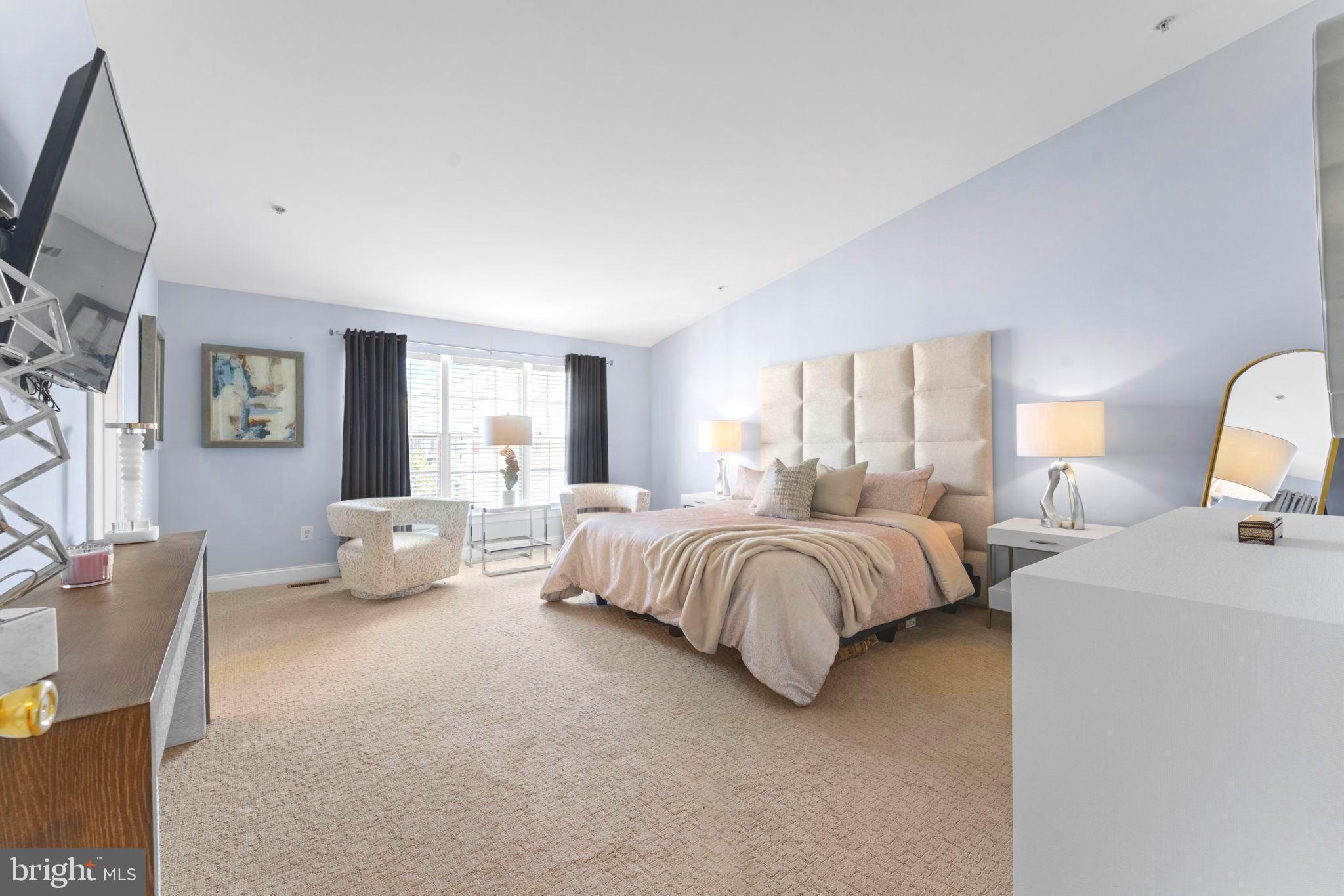 75 Swanton Lane, Unit 200 Gaithersburg, MD 20878 - Photo 16 of 54 a spacious bedroom with a bed and a couch