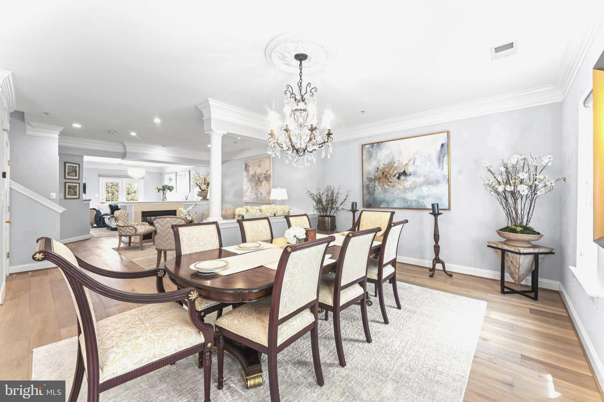 75 Swanton Lane, Unit 200 Gaithersburg, MD 20878 - Photo 3 of 54 a dining room with furniture a chandelier and wooden floor