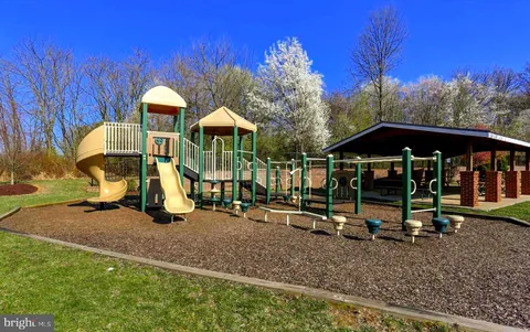 a view of a lake with a house in the background