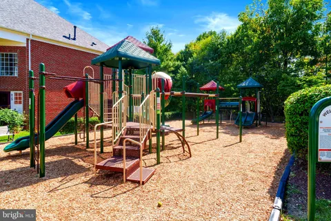a view of a building with sitting space and porch