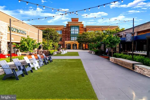 a view of a chairs with potted plants