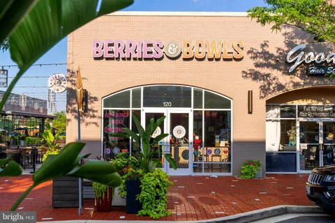 a view of a house with a backyard porch and sitting area