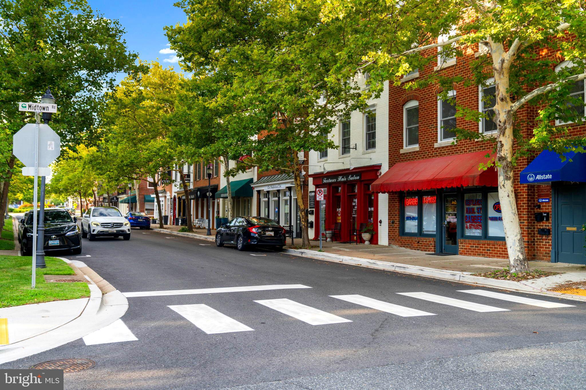 75 Swanton Lane, Unit 200 Gaithersburg, MD 20878 - Photo 51 of 54 a view of a building with a street and trees
