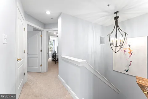 a view of a hallway view with staircase