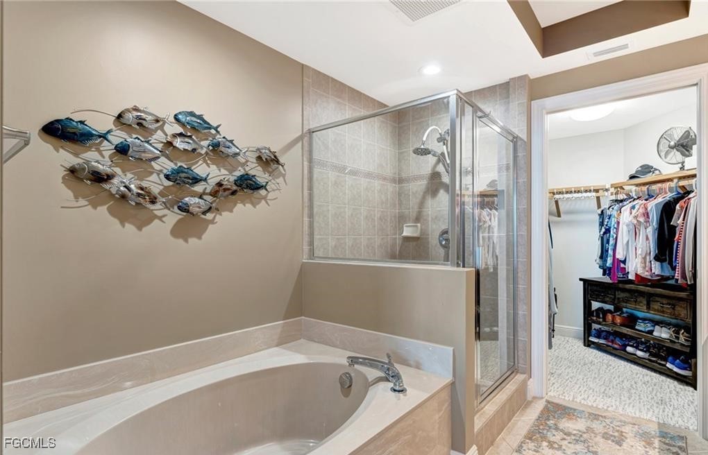 2745 First Street, Unit 2602 Fort Myers, FL 33916 - Photo 12 of 29 a bathroom with a bathtub and a shower