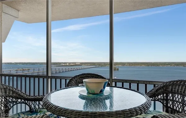 a view of a balcony and floor to ceiling window