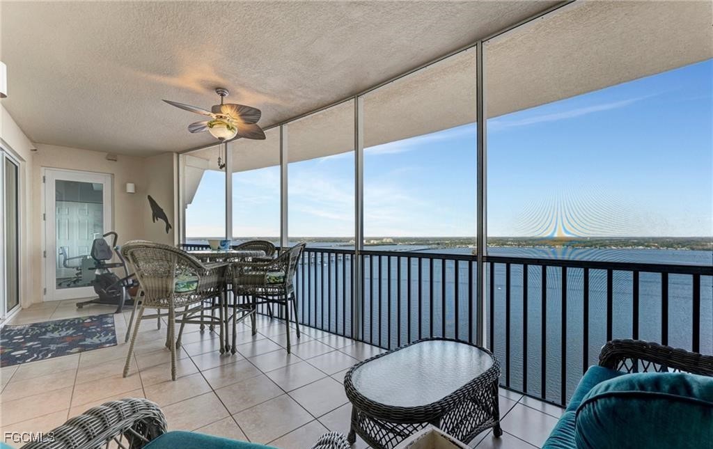 2745 First Street, Unit 2602 Fort Myers, FL 33916 - Photo 16 of 29 a view of a dining room and furniture window and wooden floor