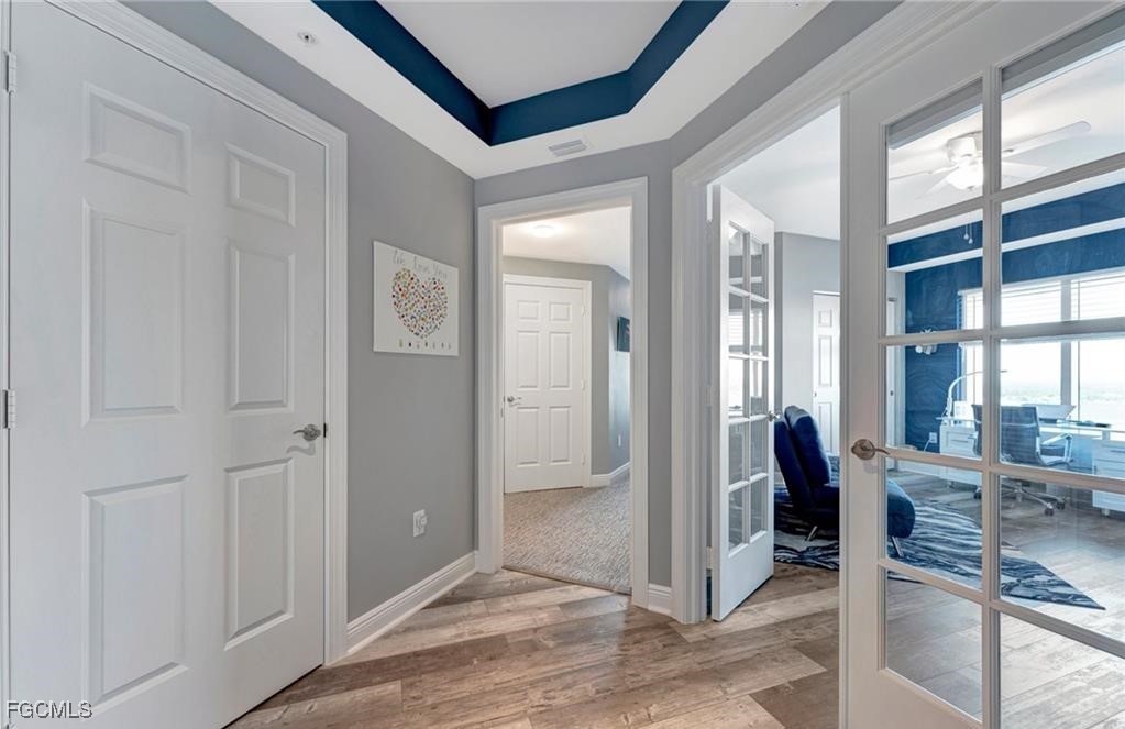 2745 First Street, Unit 2602 Fort Myers, FL 33916 - Photo 21 of 29 wooden floor and dining room with furniture