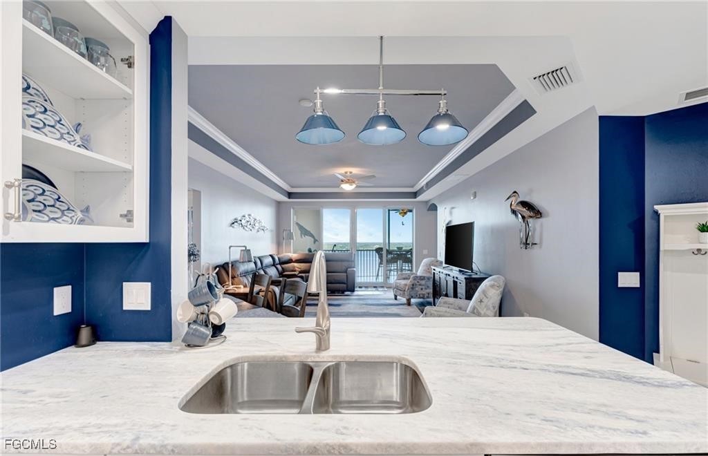 2745 First Street, Unit 2602 Fort Myers, FL 33916 - Photo 5 of 29 a view of a room with a chandelier furniture and windows