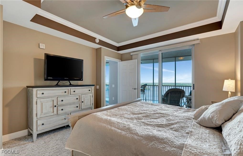 2745 First Street, Unit 2602 Fort Myers, FL 33916 - Photo 10 of 29 a bedroom with a large bed and flat tv screen on dresser