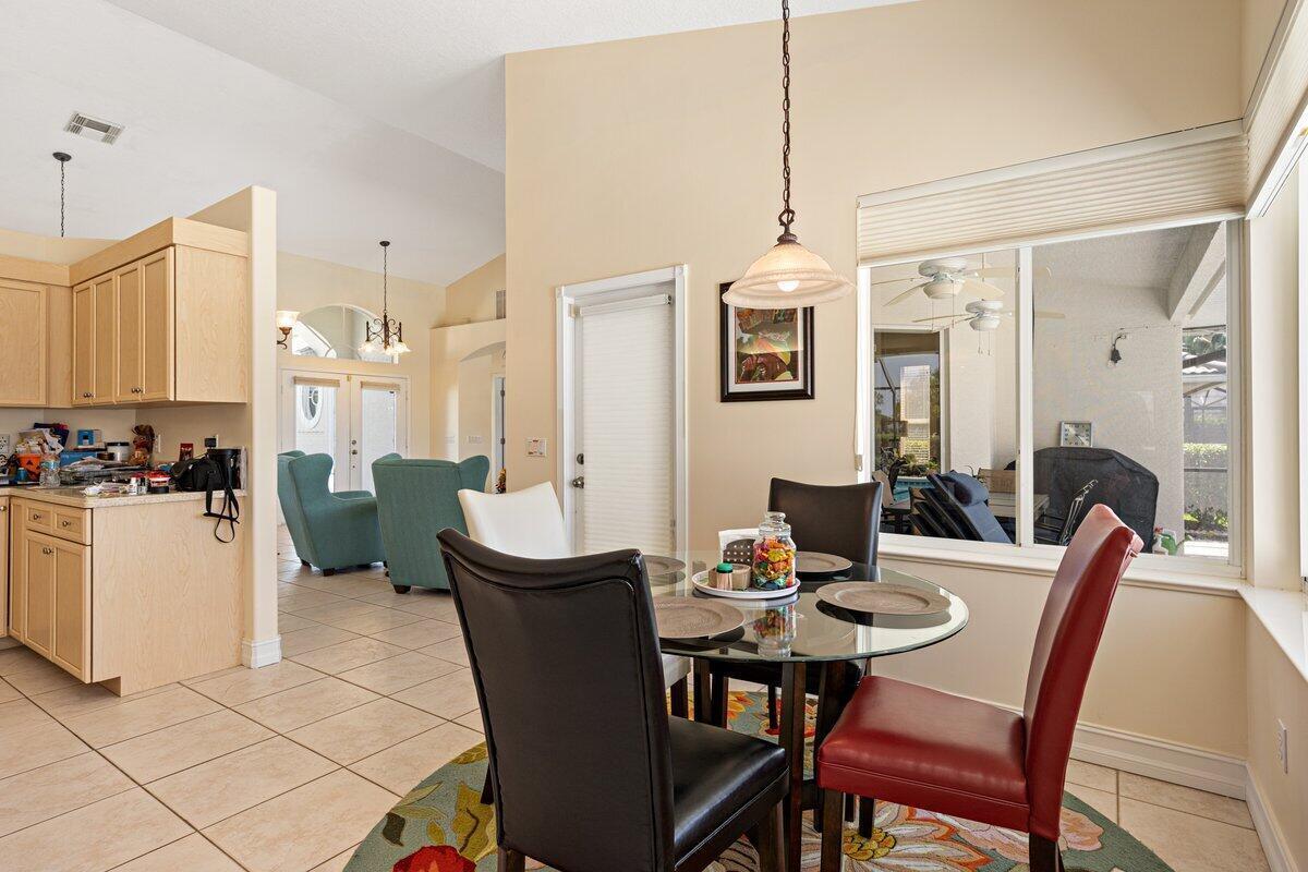 212 Southwest Whitewood Drive Port St. Lucie, FL 34953 - Photo 12 of 26 a view of a dining room with furniture