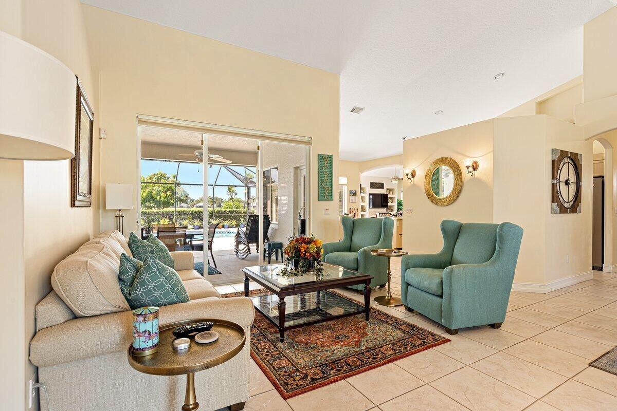 212 Southwest Whitewood Drive Port St. Lucie, FL 34953 - Photo 24 of 26 a living room with furniture and a large window