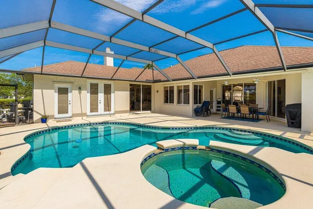 a view of a swimming pool with a patio