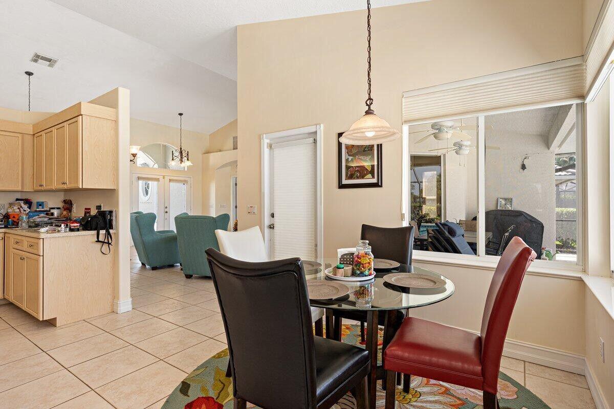 212 Southwest Whitewood Drive Port St. Lucie, FL 34953 - Photo 10 of 26 a view of a dining room with furniture