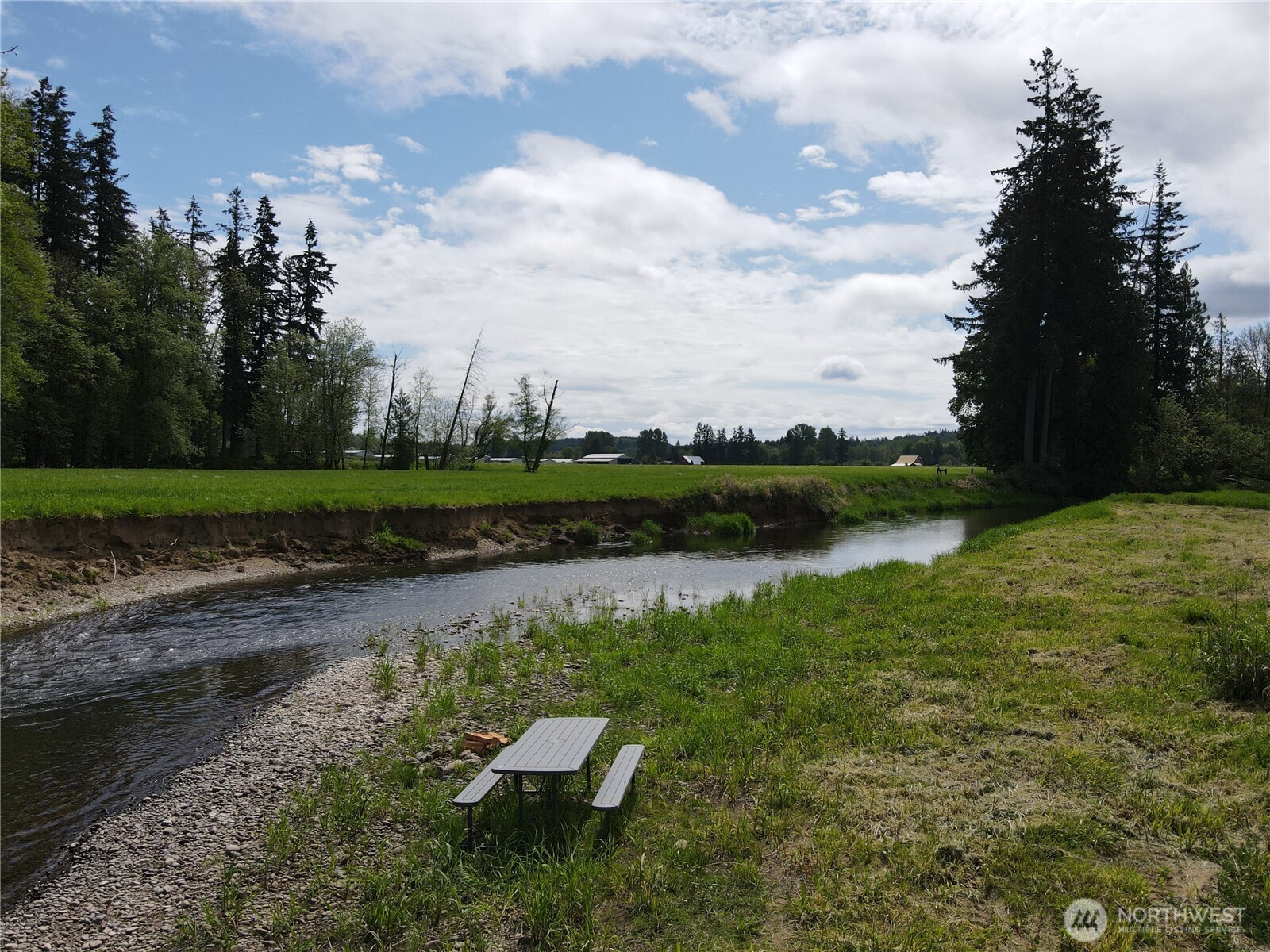 116 Anglers Lane Chehalis, WA 98532 - Photo 14 of 27 a view of a lake with a yard and wooden fence
