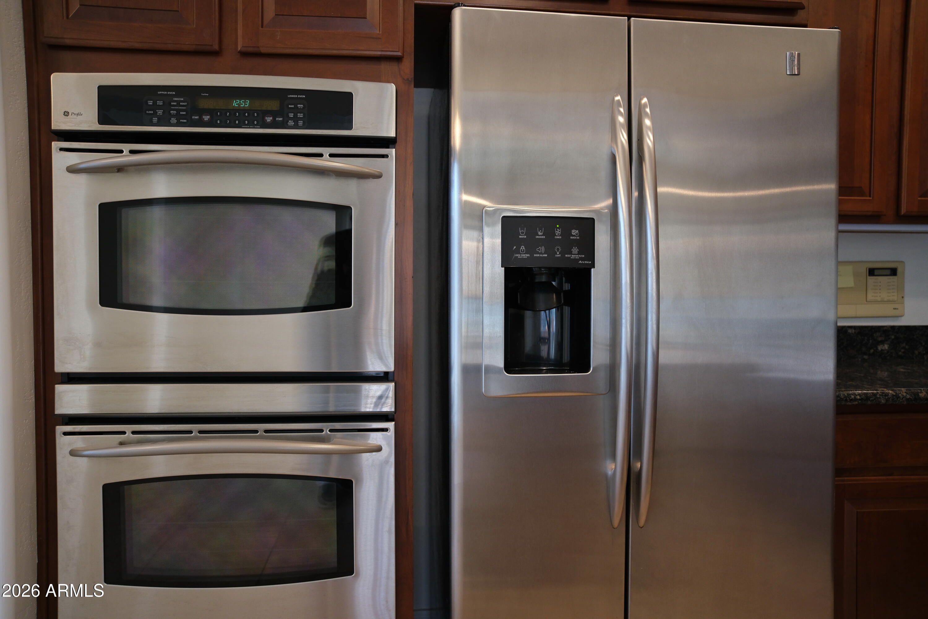 8367 West Briles Road Peoria, AZ 85383 - Photo 15 of 30 a stove top oven sitting inside of a kitchen