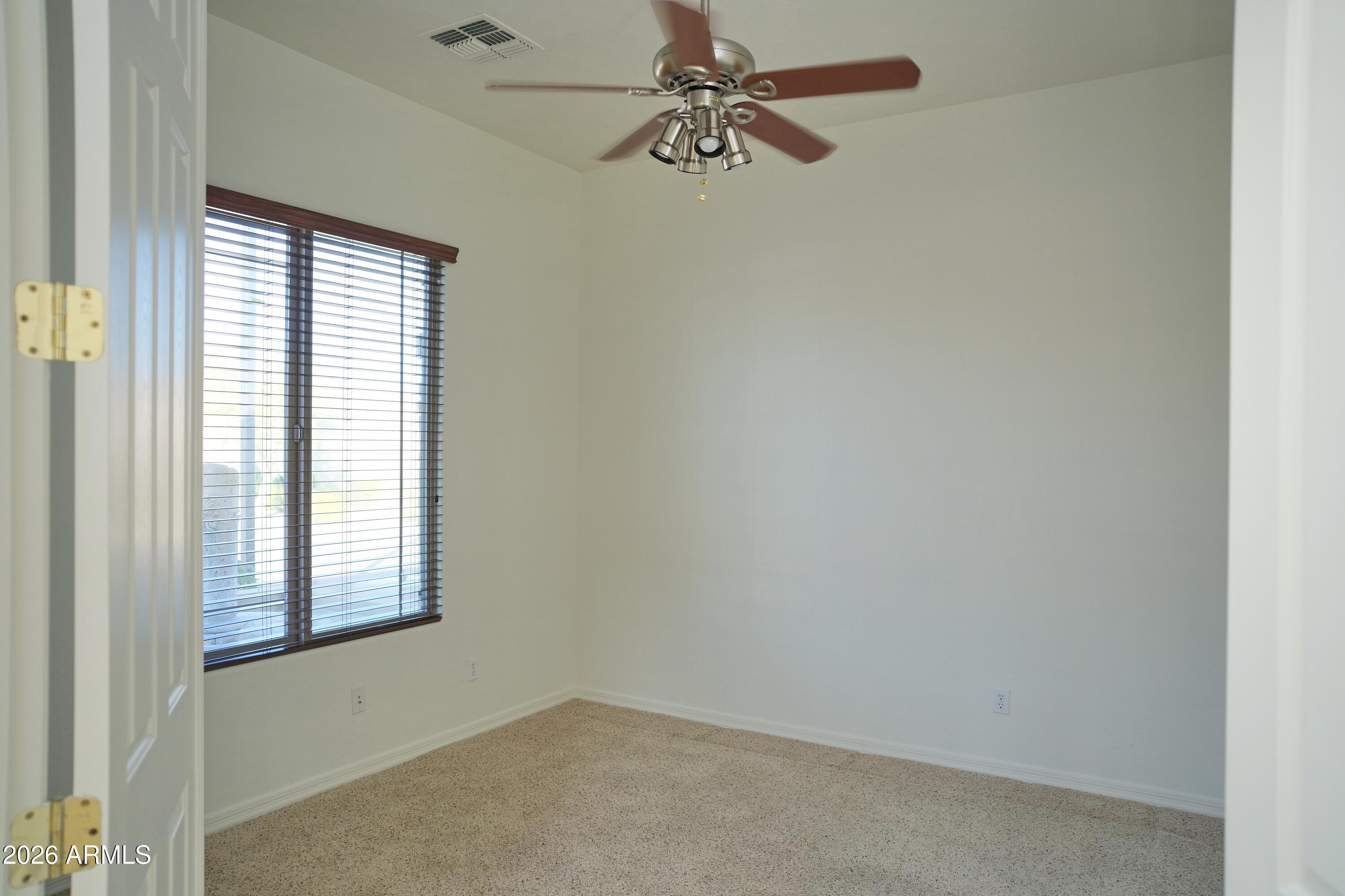 8367 West Briles Road Peoria, AZ 85383 - Photo 19 of 30 an empty room with windows