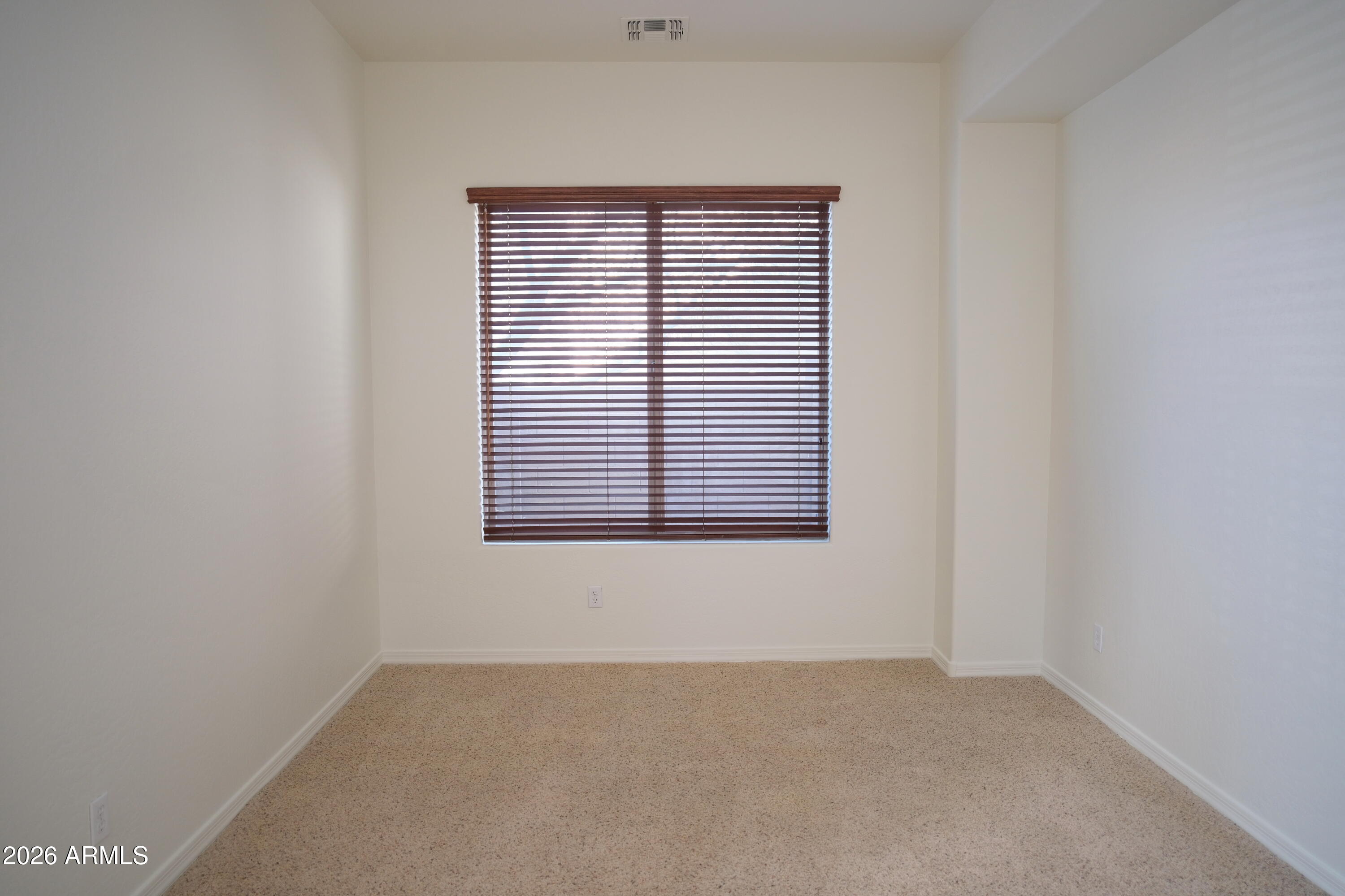 8367 West Briles Road Peoria, AZ 85383 - Photo 25 of 30 an empty room with a window
