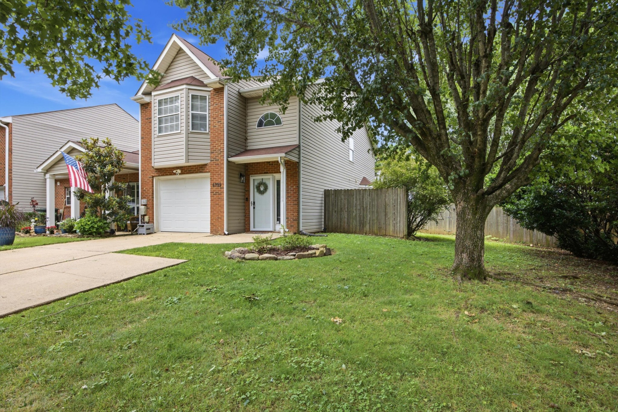 6729 Hickory Trace Circle Chattanooga, TN 37421 - Photo 3 of 30 a front view of a house with yard
