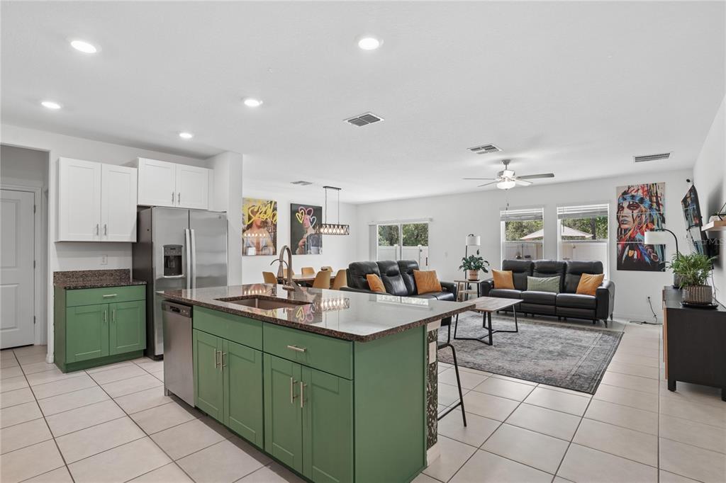 1718 Red Loop Lakeland, FL 33801 - Photo 11 of 25 a living room with kitchen island furniture and a sink