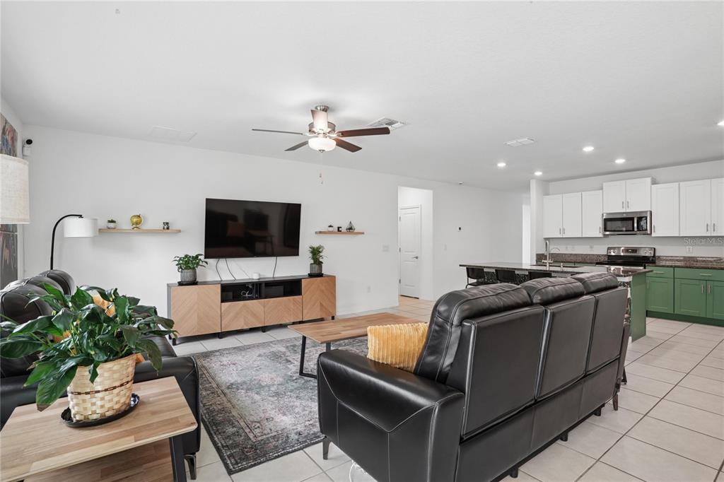 1718 Red Loop Lakeland, FL 33801 - Photo 15 of 25 a living room with furniture and a flat screen tv
